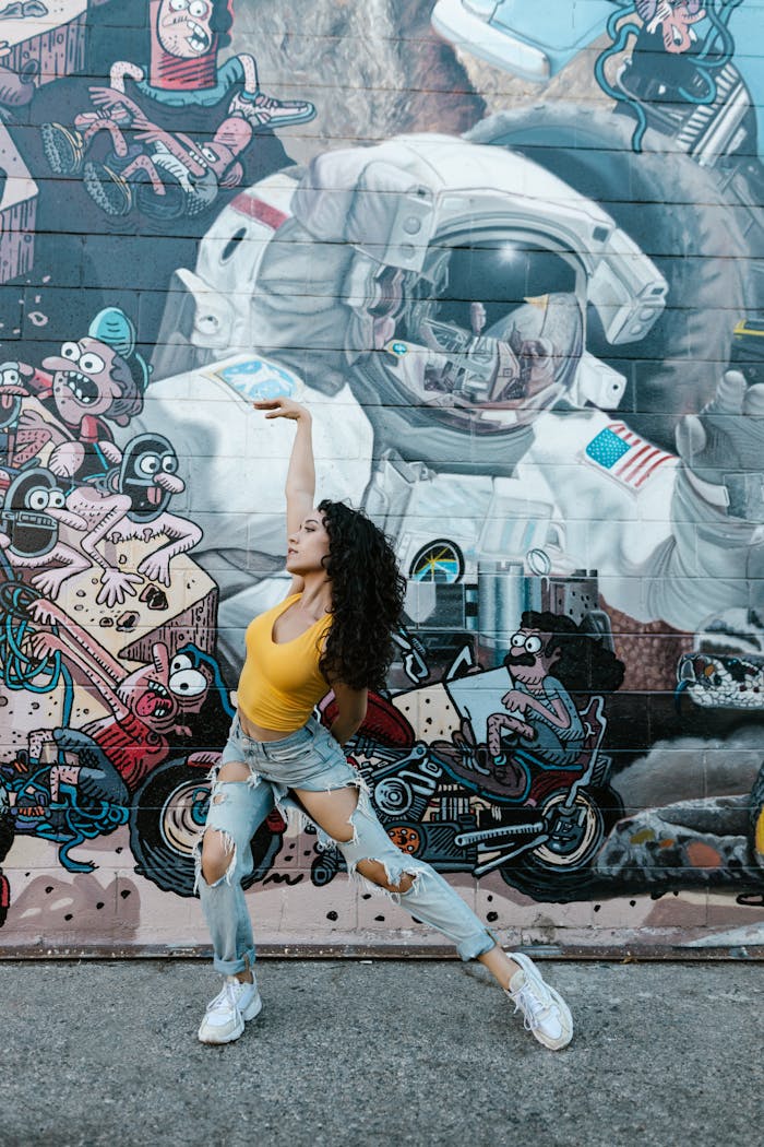 Woman Dancing with a Graffiti Wall Background